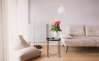 a living room with a couch, chair and a table